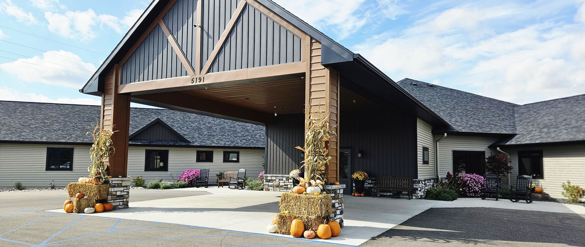The front entrance of Grace Haven Senior Living in Manton, Michigan, decorated for fall